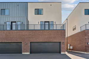 Rear view of property featuring a patio area and a garage