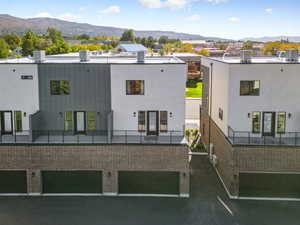 View of building exterior featuring a mountain view and a residential view