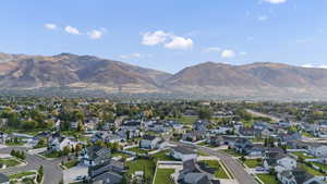 View of property location featuring a mountain backdrop and nearby suburban area