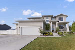 Prairie-style home featuring a porch and driveway