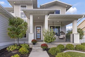 Property entrance featuring covered porch