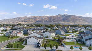 Aerial perspective of suburban area featuring a mountain backdrop