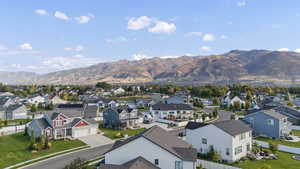 Aerial view of residential area featuring mountains