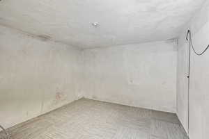 Spare room featuring light carpet