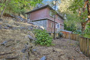 View of property exterior featuring brick siding