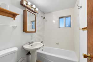 Full bath with bathtub / shower combination and toilet