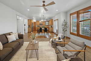 Living room with recessed lighting and a ceiling fan