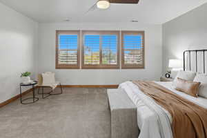 Bedroom with carpet and ceiling fan