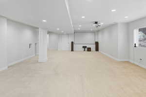 Below grade area with recessed lighting and light colored carpet