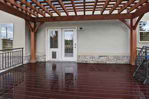 Deck featuring a pergola