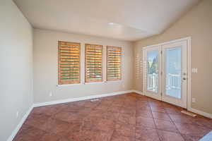 Large dining area for entertaining, opens to deck.