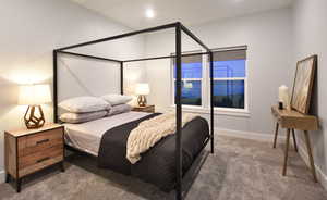 Carpeted bedroom featuring baseboards and recessed lighting