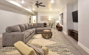 Living area featuring ceiling fan, light colored carpet, and recessed lighting