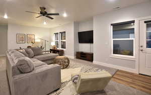 Living room featuring a ceiling fan and wood finished floors