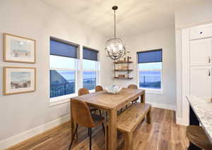 Dining room with a chandelier and light wood-style flooring