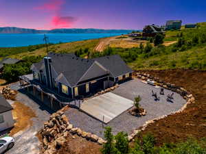 View of subject property featuring a water and mountain view