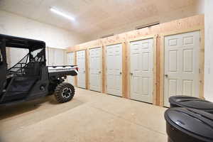 Misc room with concrete floors and a garage