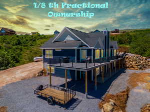 Back of house at dusk with a patio area, a shingled roof, a deck, and a chimney