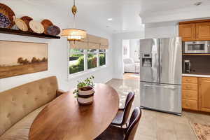 Dining space featuring ornamental molding, recessed lighting, and light tile patterned floors
