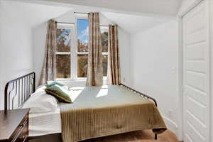 Carpeted bedroom featuring baseboards