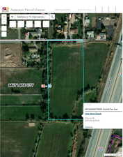 Aerial overview of property's location with property parcel outlined