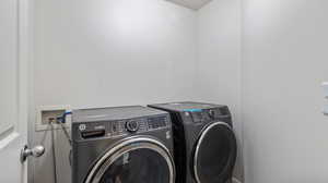 Laundry room featuring washer and clothes dryer