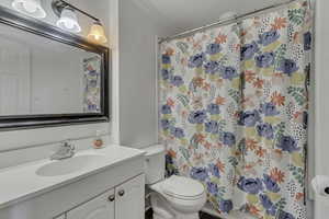Full bath featuring vanity and a shower with curtain