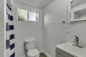 Bathroom featuring vanity and a shower with shower curtain