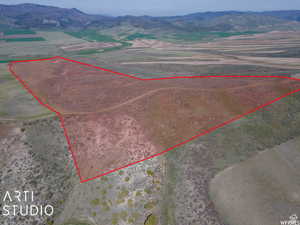 View of rural area featuring property parcel outlined and a mountain backdrop