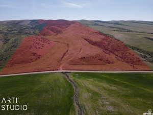 Overview of rural landscape featuring a mountainous background
