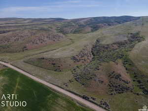 Overview of rural landscape featuring a mountainous background