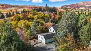 View from above of property with a forest