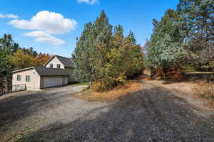 View of front of property featuring driveway and a garage