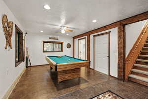 Rec room with billiards table, a textured ceiling, recessed lighting, and ceiling fan
