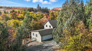 View from above of property with a forest