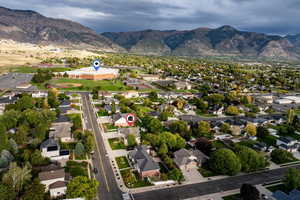 View of property location with mountains and nearby suburban area
