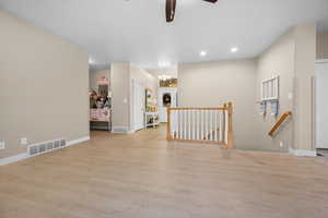 Great Room open to entry, stairwell and kitchen.