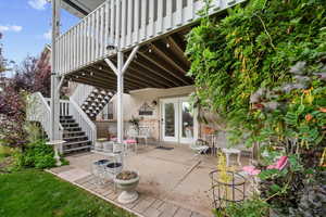 View of patio / terrace with stairs and a wooden deck