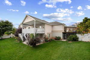 Rear view of property with stairs, stucco siding, a patio area, and a gate
