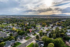 Aerial view of property's location with a mountainous background