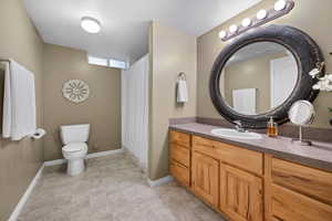 Large Bathroom  in basement with vanity and a stall shower
