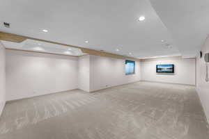 Below grade area with carpet floors and recessed lighting