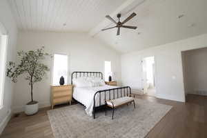 Bedroom with hardwood / wood-style floors, ceiling fan, and wooden ceiling