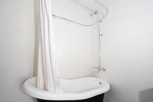 Full bath featuring shower / bath combo