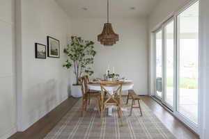 Dining room featuring wood finished floors and baseboards
