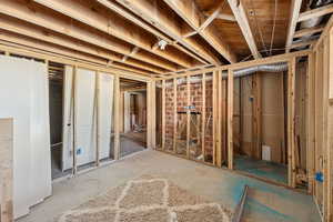 View of unfinished below grade area with fireplace