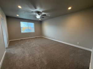 Master bedroom featuring light carpet, recessed lighting, a textured ceiling, and ceiling fan