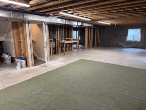 Unfinished basement with stairway