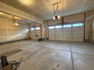 Garage featuring a garage door opener