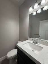 Half bath with toilet and vanity